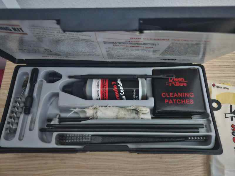 Four Gun cleaning Kits and Bore Light and 