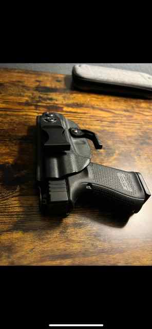 Glock 19 Gen 5 with holster and ammo